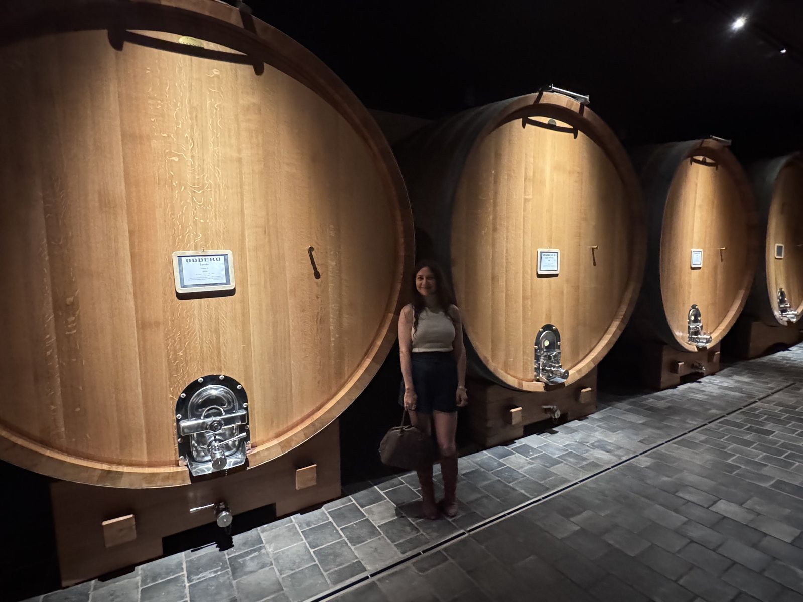 Teri among the large casks in the new cellar at Oddero, La Morra